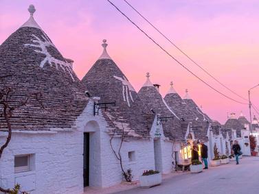 Alberobello, Italy. Twilight over traditional Trulli houses with conical roofs.