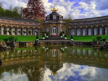 Bayreuth Travel Guide: Ornate pavilion reflecting in the water at the Eremitage Palace gardens.