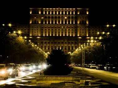 Bucharest Travel Guide: Palace of the Parliament with modern architecture surroundings.