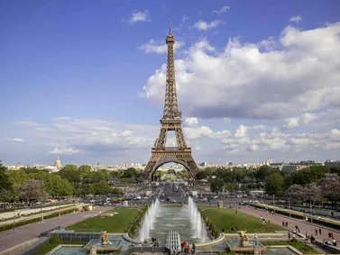 France: Eiffel Tower dominates the skyline, with fountains and greenery in the foreground.