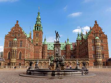 Hillerod, Denmark. Renaissance architecture of Frederiksborg Castle with a fountain in front.