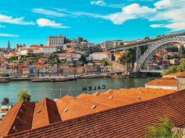 Porto, Portugal: Dom Luís I Bridge and terracotta rooftops beside Douro River.