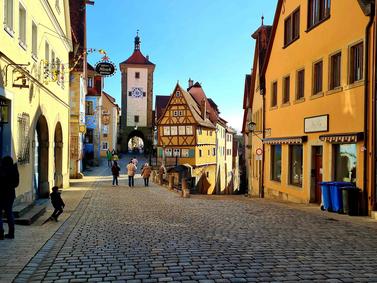 Rothenburg ob der Tauber, Germany. Cobblestone street leading to Plönlein with timbered houses.