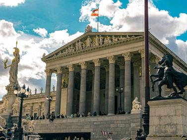 Vienna, Austria. Austrian Parliament Building with Pallas Athena statue in the foreground.