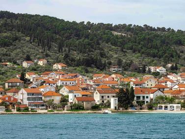 Zadar, Croatia. Coastal town with terracotta roofs against a backdrop of dense green hills